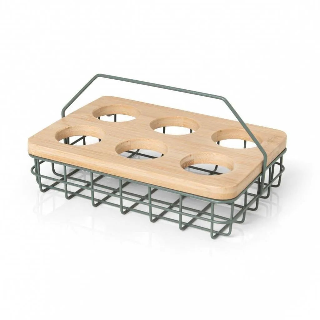 Porta ovos de metal na cor verde da linha Enjoy, em uma bancada de cozinha.